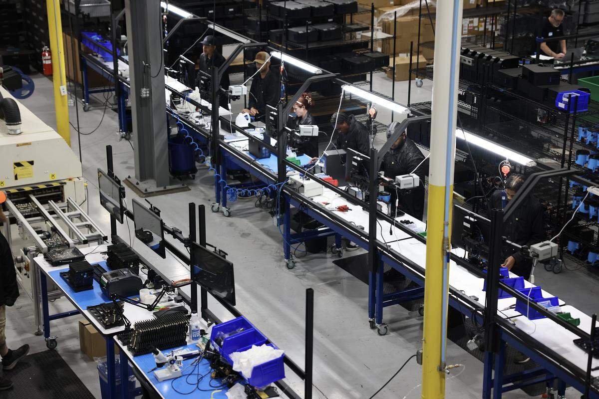 Assembly workers make Chilipad docks at Chilipad by Sleepme’s manufacturing center on Raceway Drive in Mooresville.