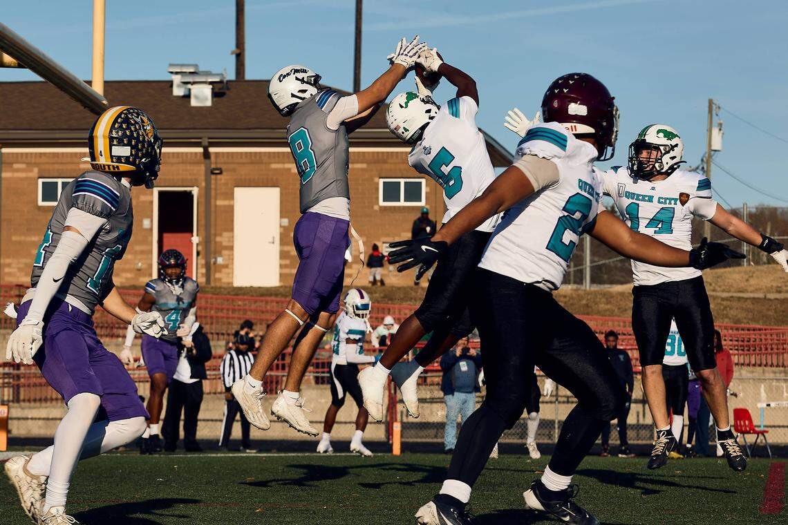 Myers Park DB Jonathan Hines (5) snatches an interception out of the air to stop the two-point conversion for the East Team in the Queen City Senior Bowl hosted at Olympic High School.