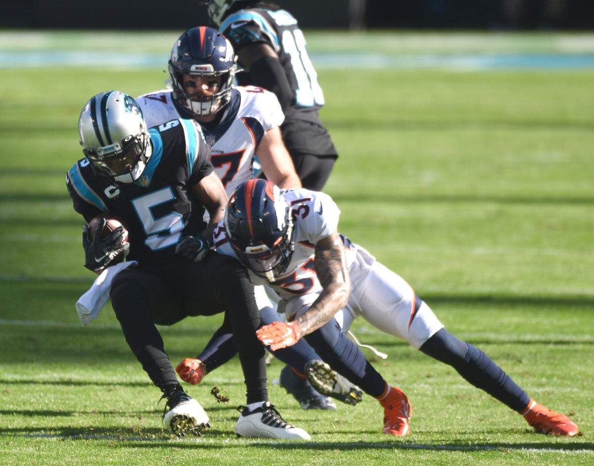 Carolina Panthers quarterback Teddy Bridgewater is tackled by Denver Broncos safety Justin Simmons in December. Bridgewater was traded to Denver Wednesday.