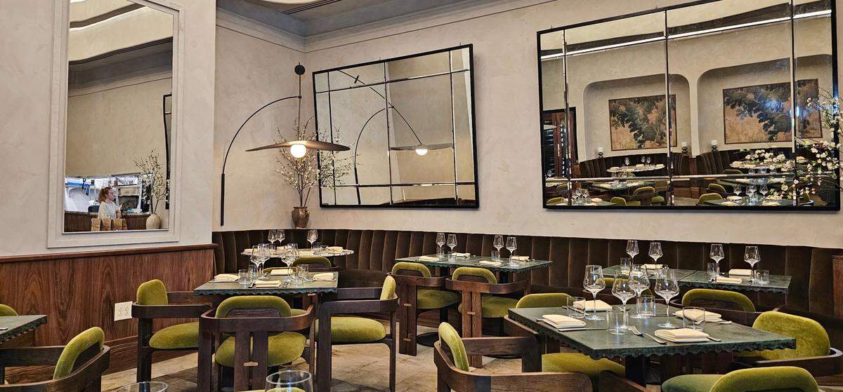 Albertine’s dining room offers plush seating in chairs and its banquette.