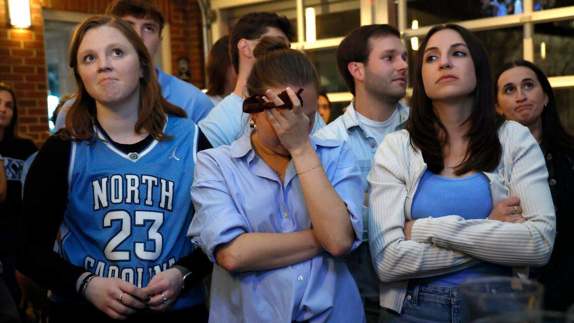 UNC-Chapel Hill medical student Grace Fuller, center, reacts while watching the final seconds of the Tar Heels’ 74-71 ACC Tournament semifinal loss to Duke on Friday, March 14, 2025, at Top of the Hill in Chapel Hill, N.C.