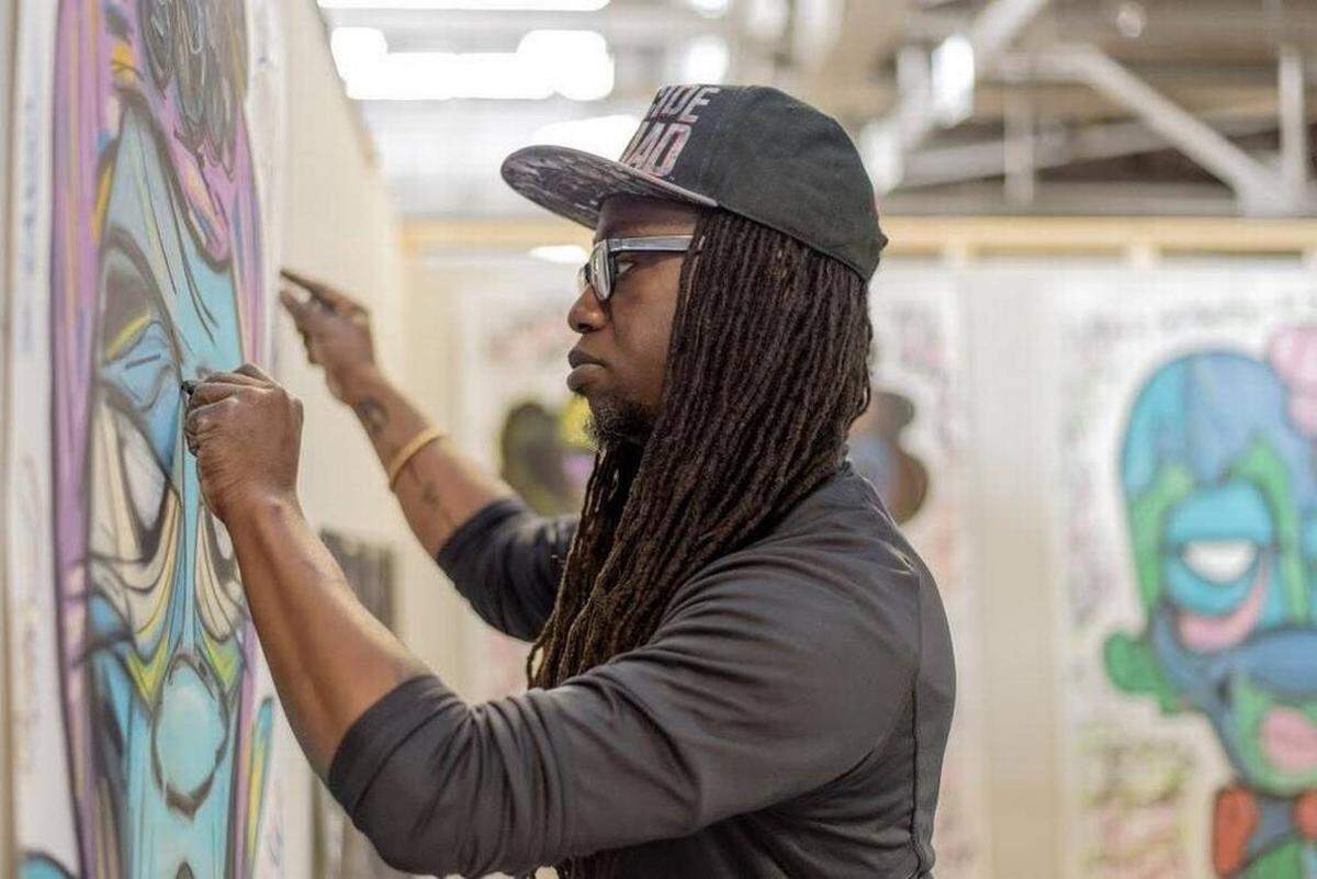 Artist de’Angelo Dia at work at Goodyear Arts.