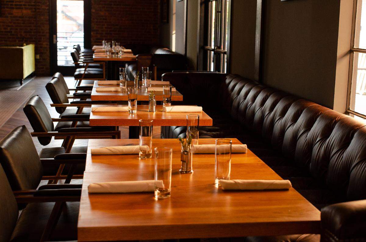 BOCADO Bar + Diner’s 2,700-square-foot interior includes modern updates while maintaining the history of the 1919 structure, built as part of a manufacturing facility.