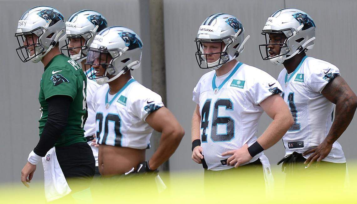 Carolina Panthers rookie long snapper Thomas Fletcher, second from right, waits with his teammates to begin drills during the teamÕs 2021 rookie minicamp practice on Friday, May 14, 2021.