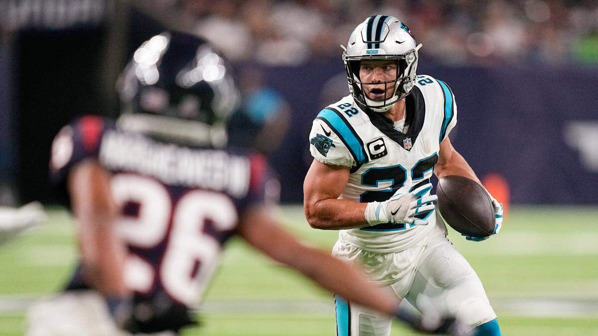 Carolina Panthers running back Christian McCaffrey (22) rushes for a gain as Houston Texans cornerback Vernon Hargreaves III (26) defends during the first half of an NFL football game Thursday, Sept. 23, 2021, in Houston.