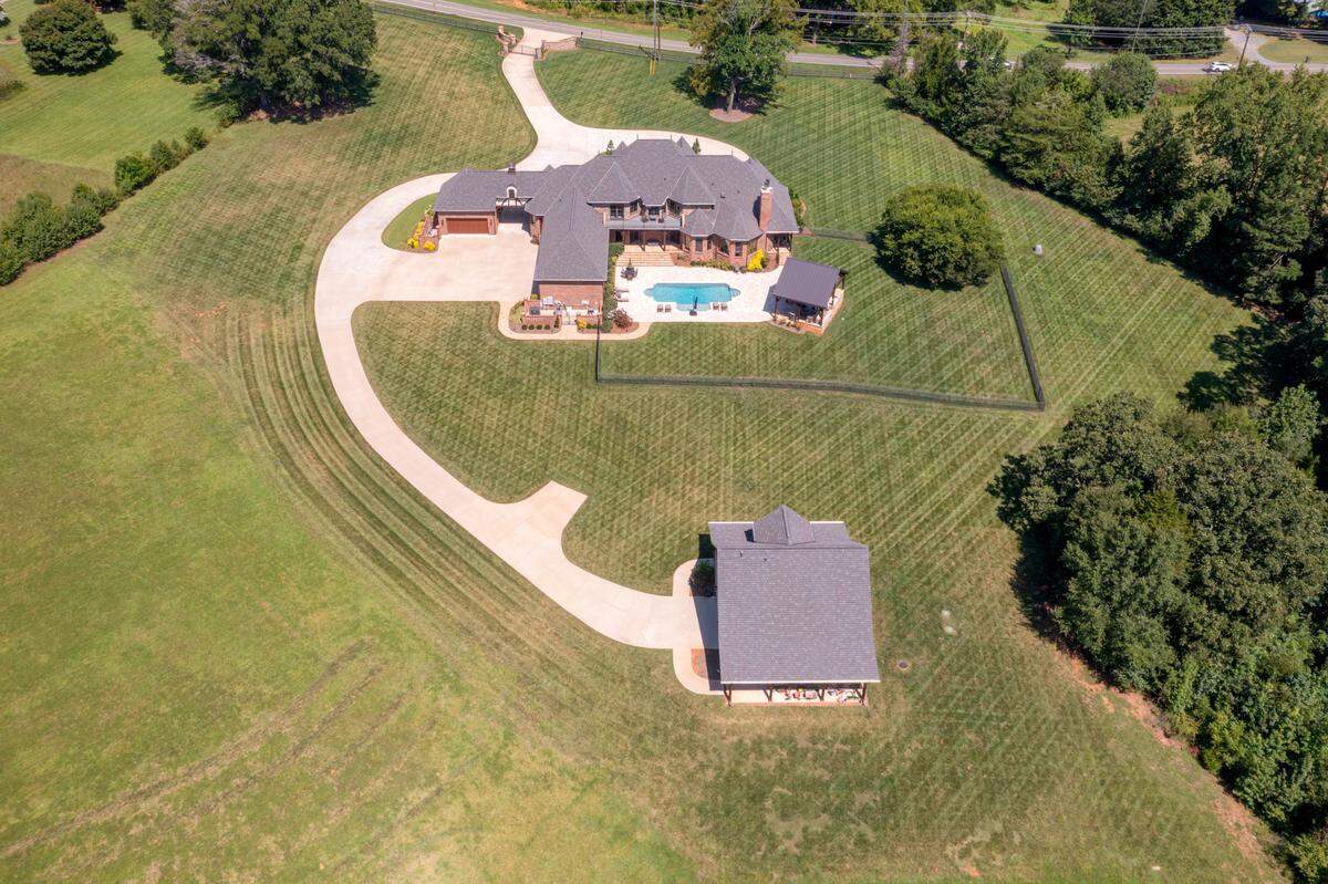 The grounds of the property contain two bass ponds, trails and a carriage house with five stalls for storage, according to the property listing.