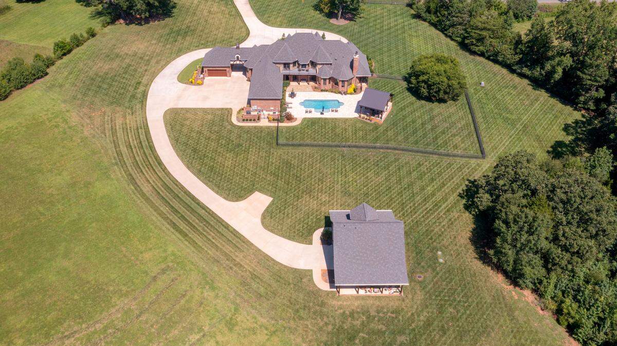 The grounds of the property contain two bass ponds, trails and a carriage house with five stalls for storage, according to the property listing.