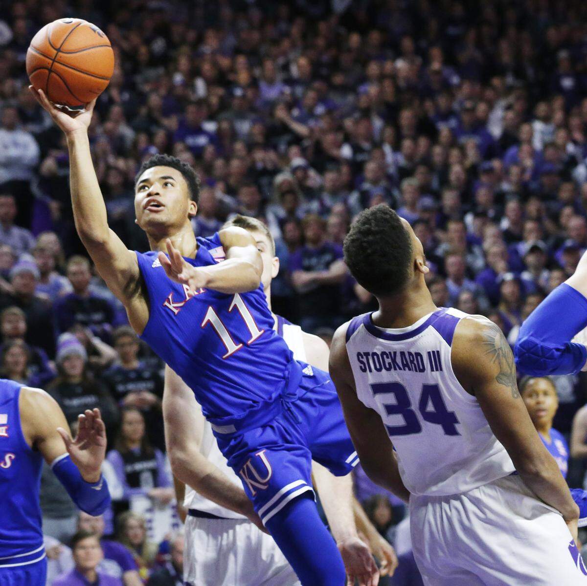 Kansas guard Devon Dotson (11) led his team with 18.1 points per game this season.