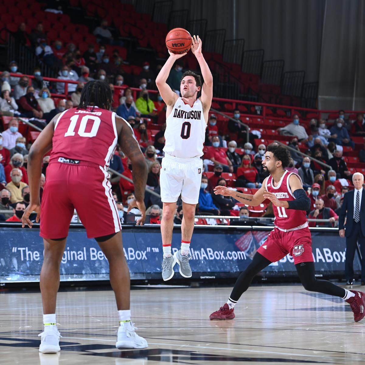 Davidson point guard Foster Loyer launches a jumper against UMass in the Wildcats’ 77-67 win on Jan. 11, 2022. The victory was Davidson’s 12th straight and by game’s end Loyer ranked fifth in the country in three-point percentage (50.0).