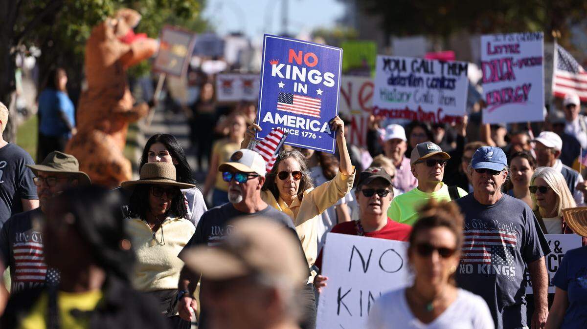 The ‘No Kings’ march makes its way through uptown Charlotte on Saturday, Oct. 18. The protest is part of a national movement to rally against policies enacted by President Donald Trump.