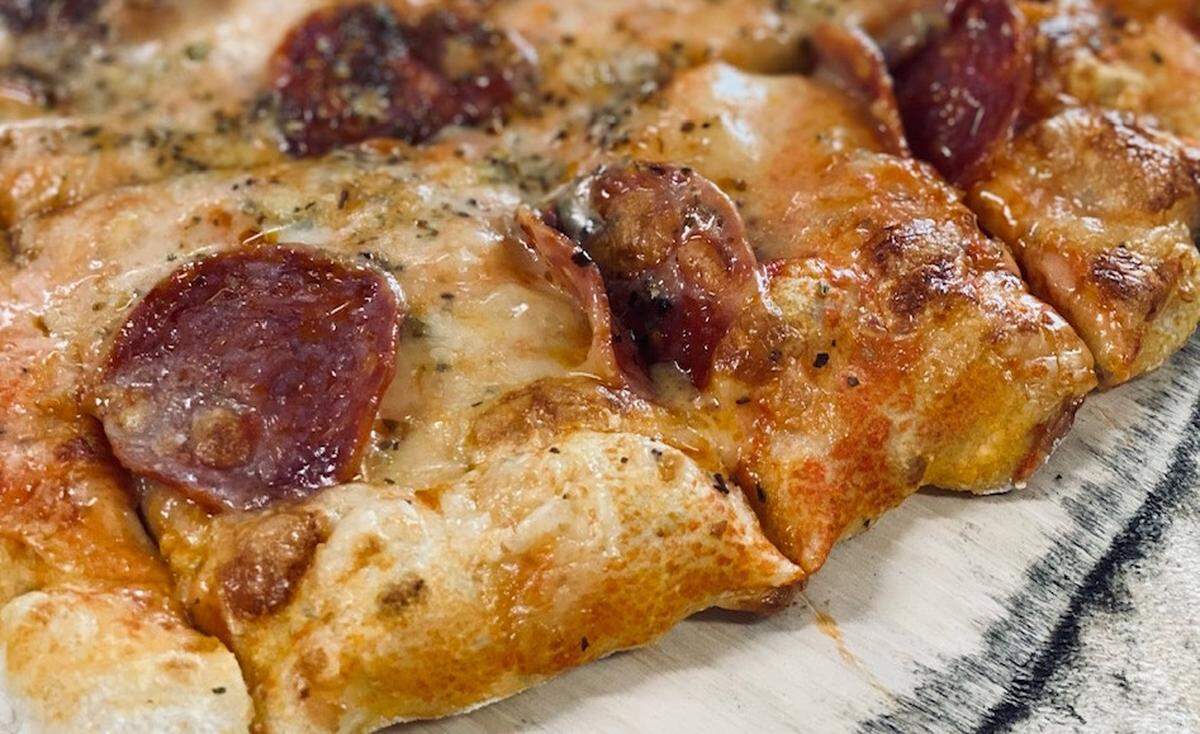The St. Louis-style pizza will have a thin, crispy crust, topped with a secret three-cheese blend.