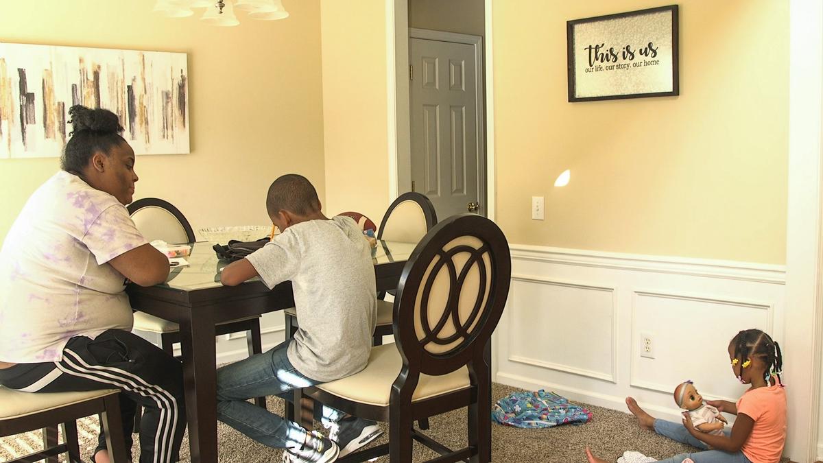 Shaquana Shaw and her children, Christian and Aubrey in their new house at Cambridge Bay Dr. in Charlotte, NC., on Wednesday, August 28, 2019.