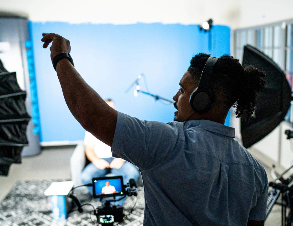 Asa Kryst directs an ad shoot. Kryst, 27, formed Blue Method Films in 2018. By 2019, he had added commercial work to his portfolio, producing promotional videos and testimonials in studios or on location for companies like Rockbox Fitness and Urban Skin RX.