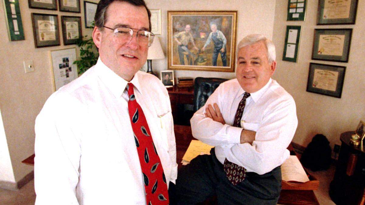 Ed Shelton, left, and Charlie Shelton are pictured in this 1994 Observer file photo. Charlie Shelton, who died Saturday, was a prominent NC homebuilder and developer for many years before he started a vineyard with his brother Ed. He was also active in politics.
