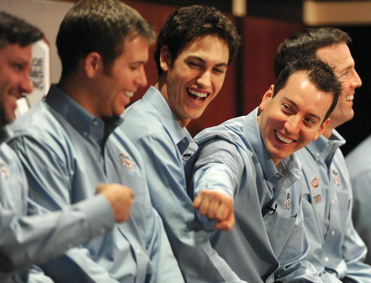 Kyle Busch, second from right, bumps fist with former Joe Gibbs Racing driver Tony Stewart, left, who made a surprise appearance during the Media Day stop at team headquarters in Huntersville. Also pictured, Brian Scott, second from left, and Joey Logano, third from left and J.D. Gibbs, right.View more photos from this event at thatsracin.com.Jeff Siner - jsiner@charlotteobserver.com