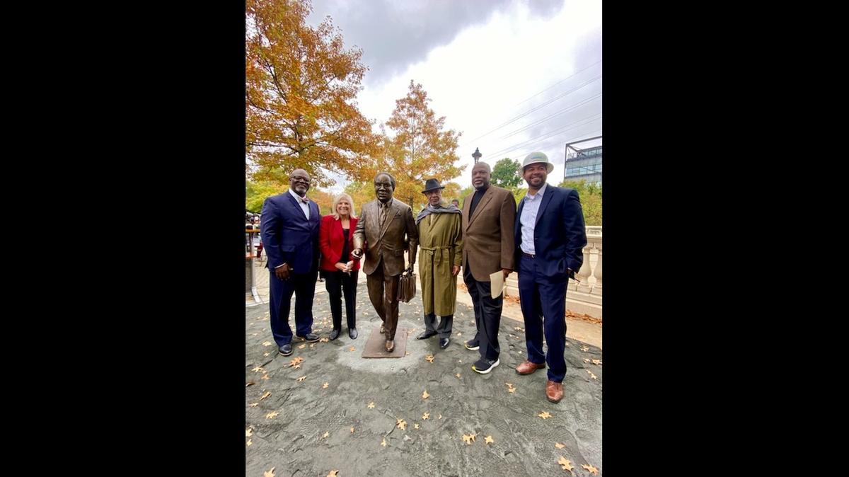 The statue of civil rights lawyer Julius Chambers was unveiled Oct. 30, 2021 on the Trail of History in Charlotte. Pictured from left: Mecklenburg county commissioners Chair George Dunlap; county Manager Dena Diorio; statue of Chambers; sculptor Ed Hamilton; David Taylor, president and CEO of the Harvey G. Gantt Center for African-American Arts + Culture; and Tyrone Harmon, CEO of Harmon Construction.