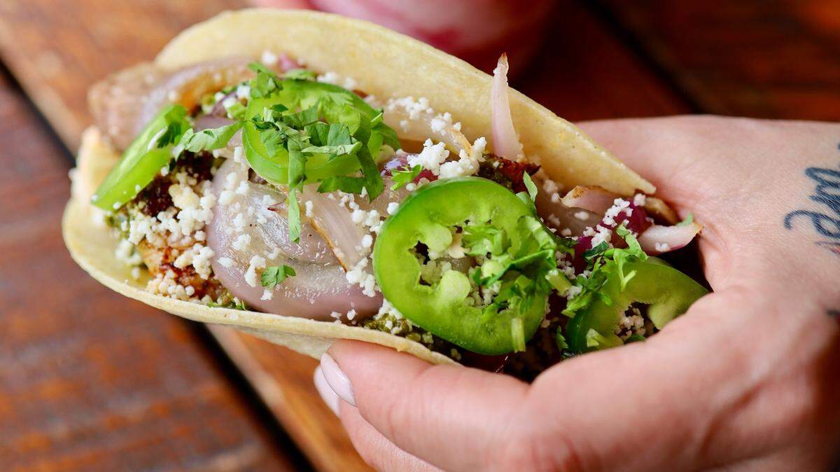 Velvet Taco’s Chat GPTaco features flank steak, blackened shrimp, red chile aioli, chimichurri, crispy potatoes, grilled onion, queso fresco, jalapeno and cilantro on a corn tortilla ($6.25).