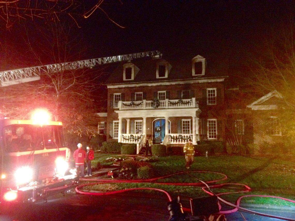 Charlotte firefighters battle a two-alarm fire on Jan. 5, 2015, at the south Charlotte home of Carolina Panthers coach Ron Rivera and his wife Stephanie. No one was hurt in the predawn blaze.