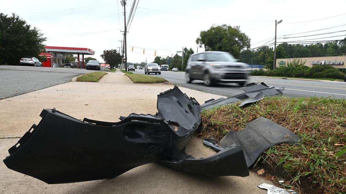 A portion of a cars front bumper remains at the intersection of North Tryon Street and Bingham Drive on Wednesday.