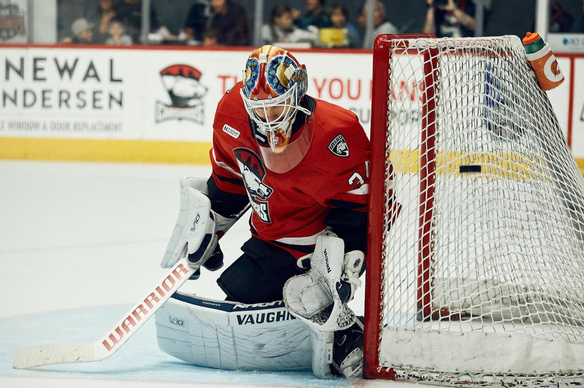 Goaltender Kaapo Kahkonen saves a ricochet shot against the Laval Rockets in Sunday’s first period. The Charlotte Checkers defeated the Laval Rocket, 5-1.
