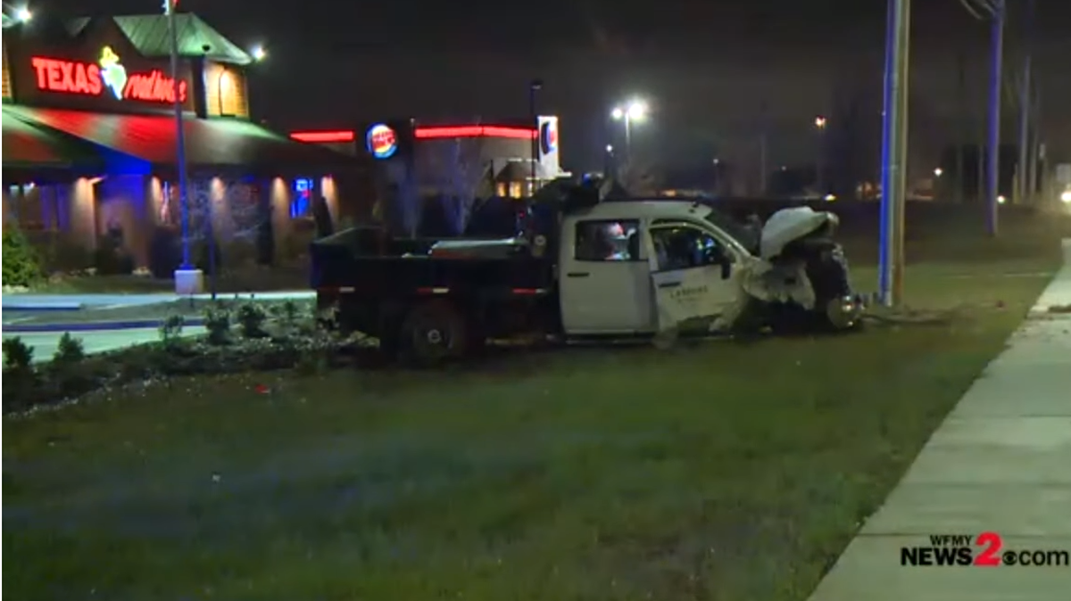 Screenshot of WFMY video of the scene where driver allegedly hit 10 cars at a restaurant parking lot in High Point. YouTube screenshot