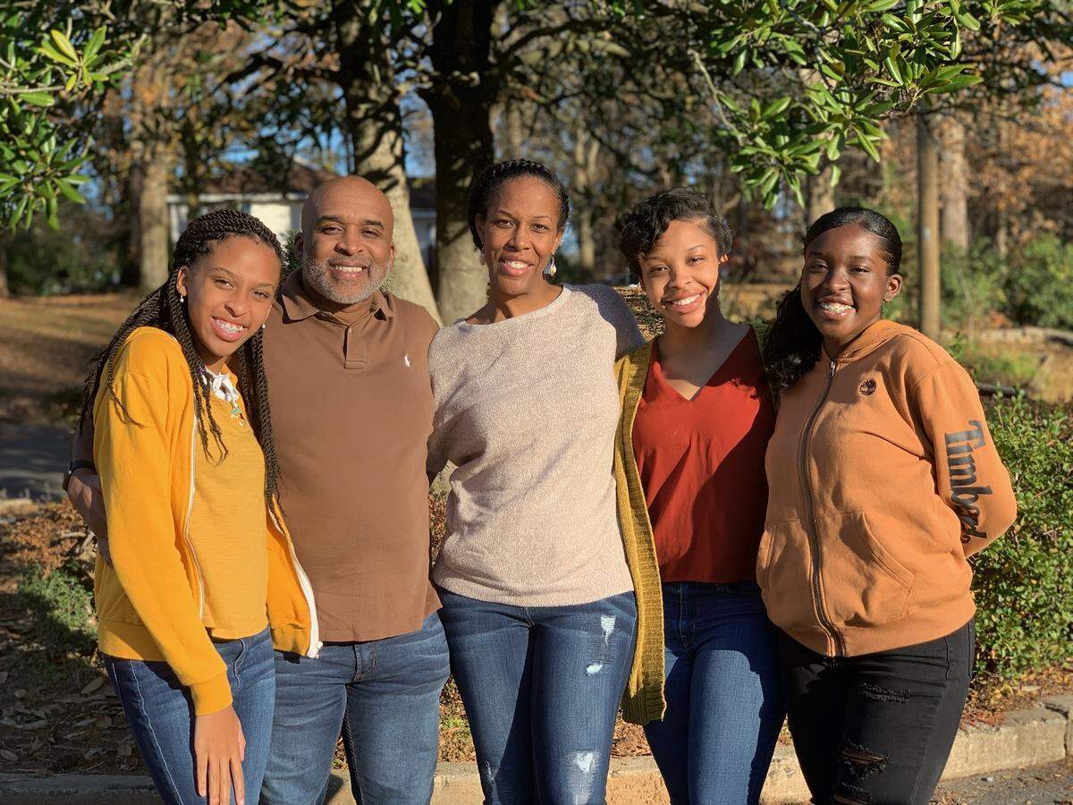 From left, Jada, Gregory “Dee”, Veronica, Imani and Nia Rankin pose for a photo. Gregory Rankin is one of two people who sued state officials because of a bill that allowed municipal charter schools in four towns in Mecklenburg County.