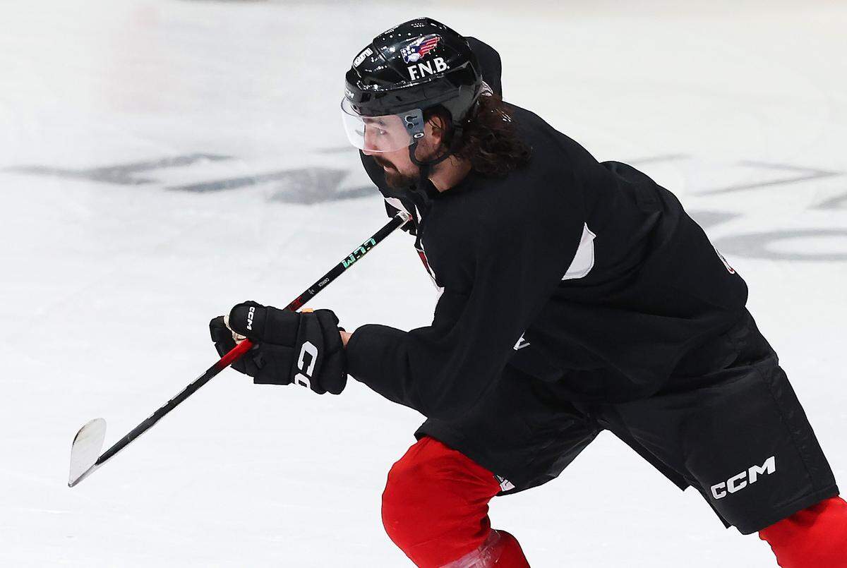 Charlotte Checkers Trevor Carrick turns toward the puck during practice at BoJangles Coliseum in Charlotte, NC on Thursday, October 9, 2025.