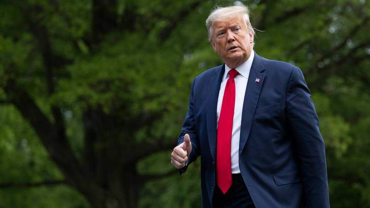 President Donald Trump gives thumbs upon returning to the White House May 14 after touring a medical equipment distribution center in Allentown, Pa. where he touted his administration’s work in producing and distributing PPE amid the coronavirus outbreak. The distribution center has sent millions of N95 masks, surgical gowns and gloves to hospitals around the country. 