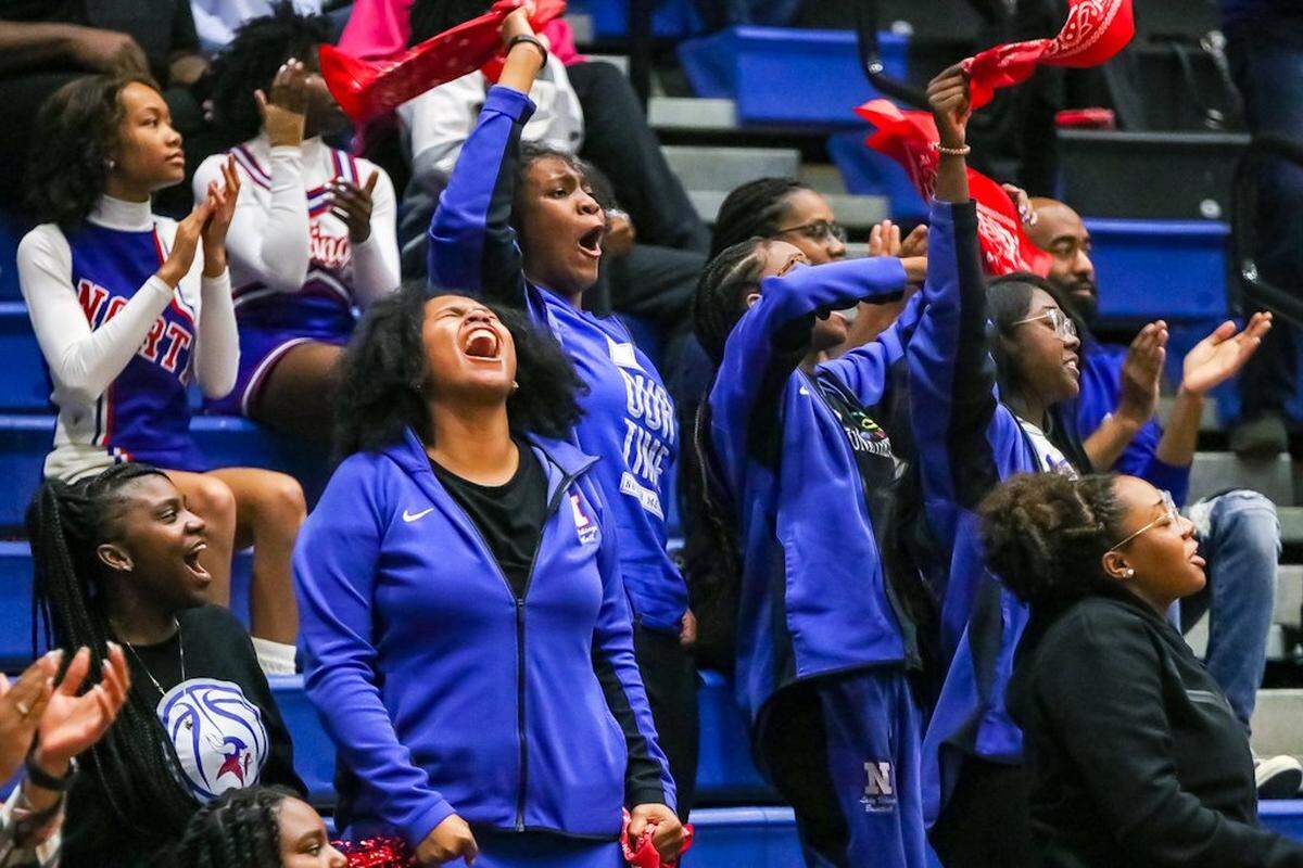 North Mecklenburg fans scream with excitement during a girls basketball game at Lake Norman.