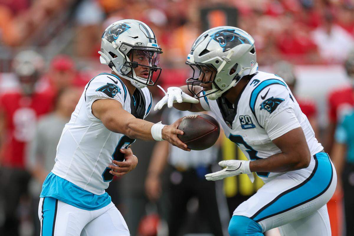 Carolina Panthers quarterback Bryce Young (9) hands off to Carolina Panthers running back Raheem Blackshear (3) against the Tampa Bay Buccaneers in the first quarter at Raymond James Stadium in Tampa, Fl. on Sunday Dec 29, 2024