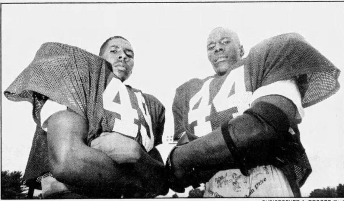 West Charlotte twin brothers Jami’h (left) and Wali Rainer anchored the Lions’ defense in the 1994 season. The brothers played in college at Virginia.