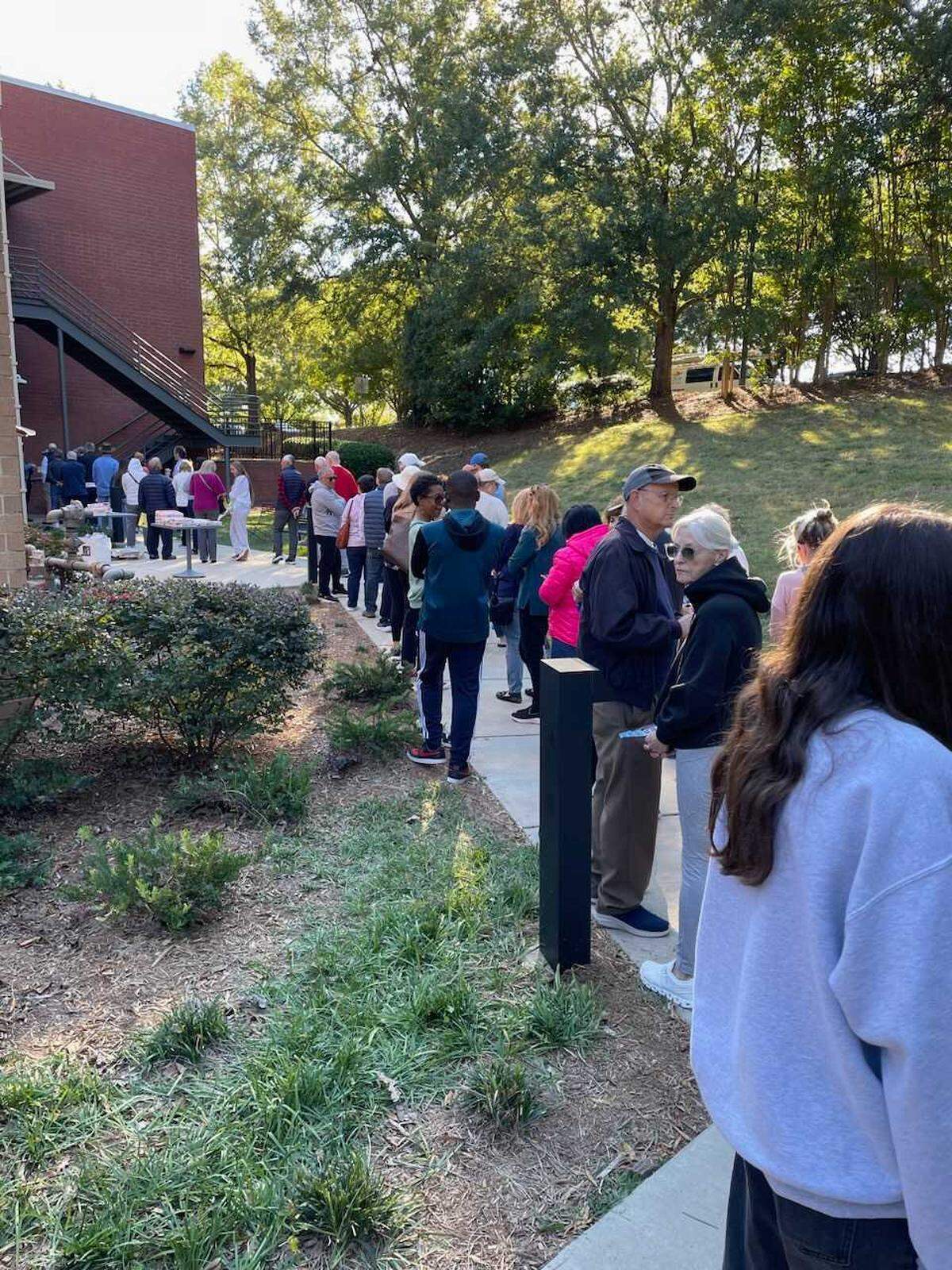 The line to vote at the South County Regional Library in Charlotte on Monday afternoon wrapped around the building.