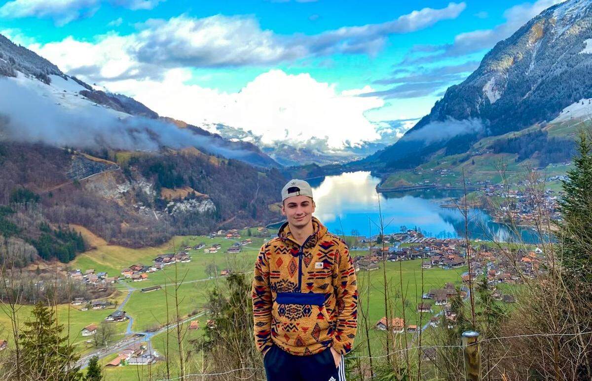 TikToker Zachary Keesee in front of Lake Lungern during a trip to Switzerland in January 2020.