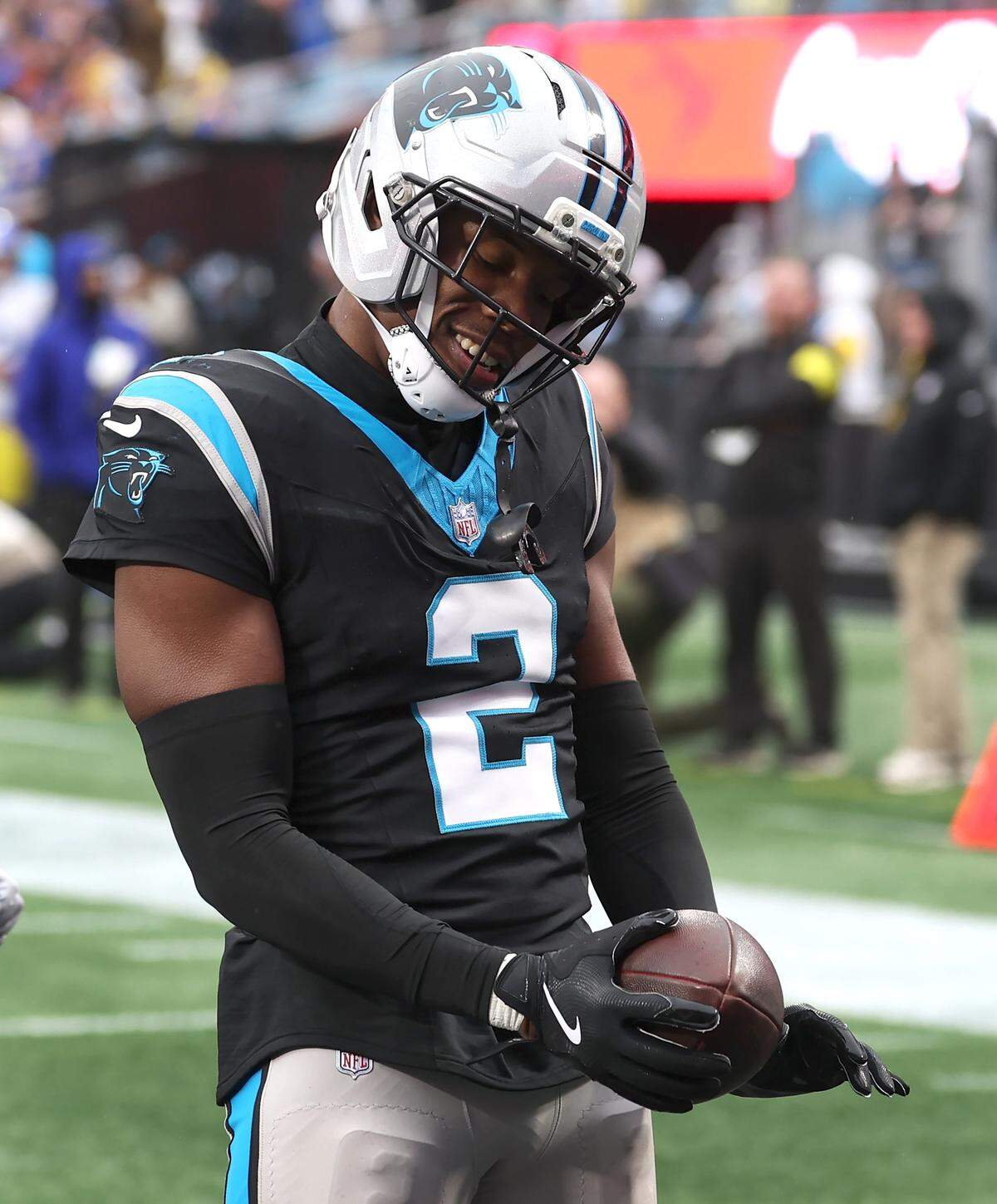 Carolina Panthers cornerback Mike Jackson dances after intercepting a pass meant for Los Angeles Rams wide receiver Puka Nacua and running for a touchdown.