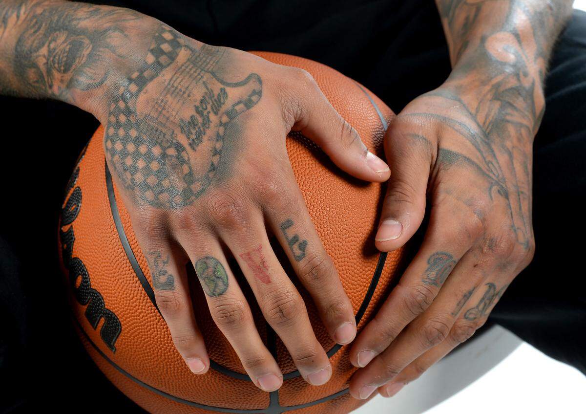 Charlotte Hornets forward/guard Kelly Oubre got his first tattoo when he was a sophomore in high school. OubreÕs first tattoo was a basketball with thorns around it. OubreÕs body is now tattooed with images of Jimi Hendrix, Michael Jackson and imagery of his birthplace New Orleans. OubreÕs right hand features a guitar reading Òthe soul never dies,Ó and Love.
