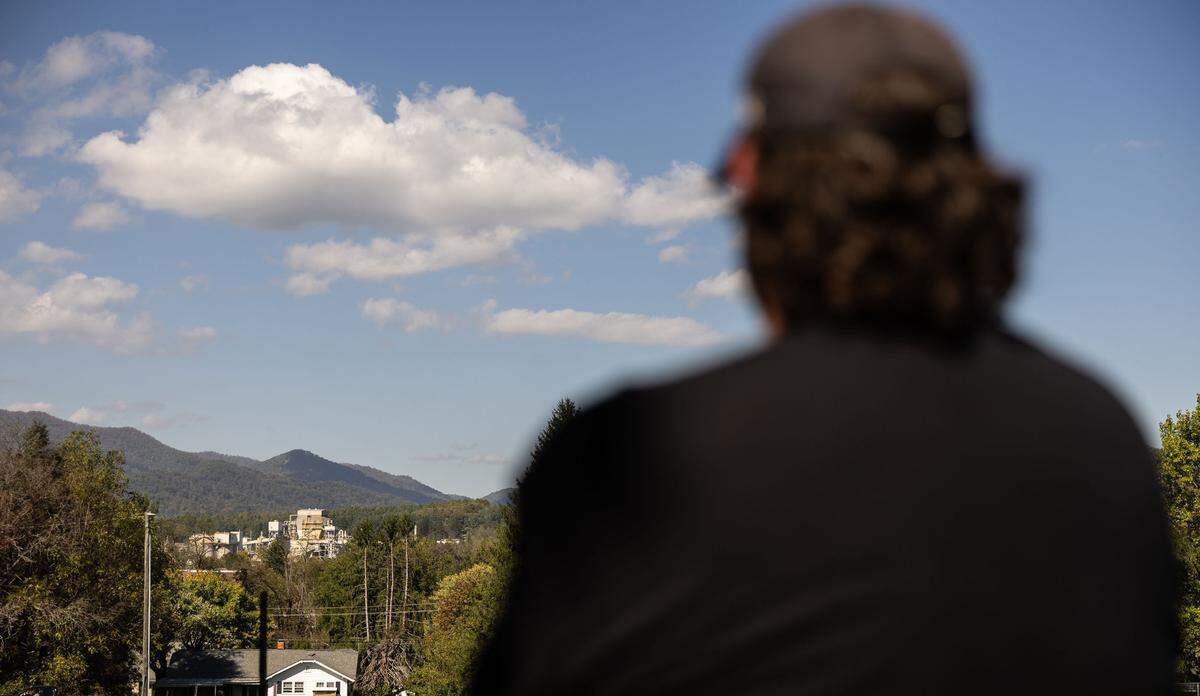 Jody Mathis looks out at the paper mill he used to work at before it closed down at Pisgah High School in Canton, N.C., on Tuesday, October 8, 2024.
