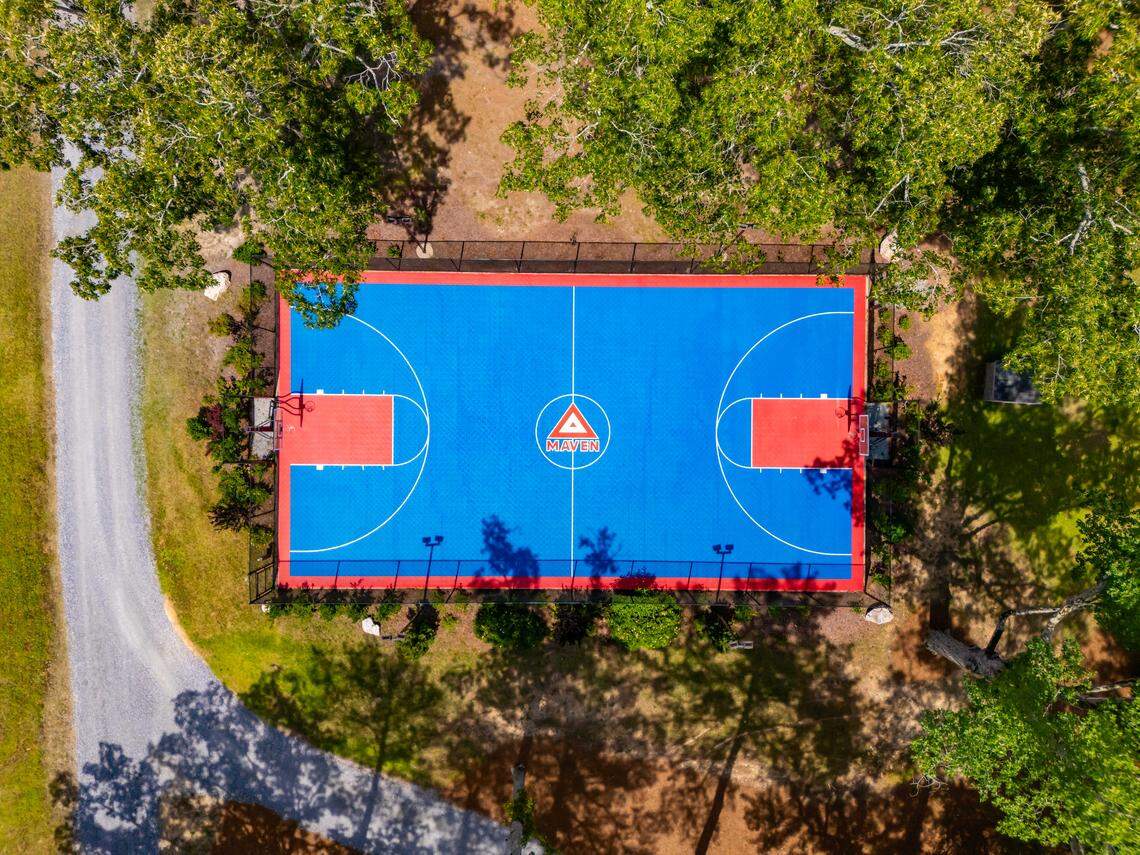 Amenities include a basketball court, an NFL-grade gym, yoga studio, sauna and sparring mat.