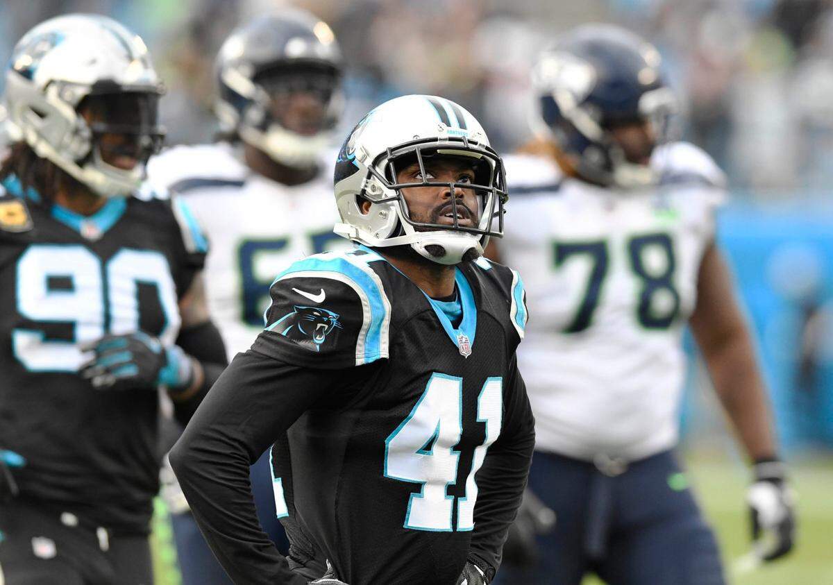Carolina Panthers defensive back Captain Munnerlyn (41) looks up at the video scene to watch the replay of a 43-yard pass play to put the Seattle Seahawks at the Panthers 10-yard line late in the game at Bank of America Stadium on Sunday, November 25, 2018. Seattle won 30-27.