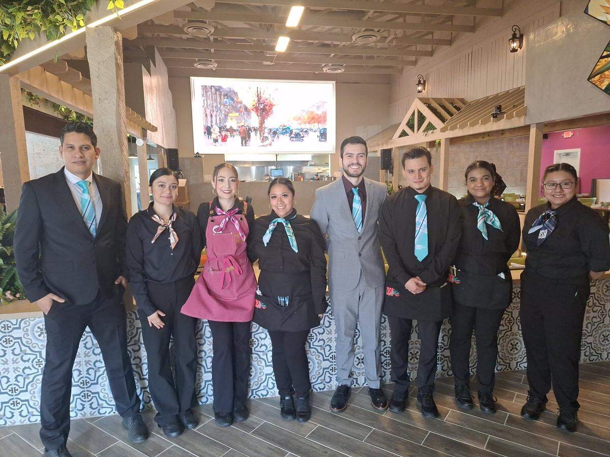“It’s something that’s different that isn’t in the area right now,” Justin Santillan, fifth from left, said about his family’s new Casa Azteca Mexican Grill in Mooresville. He is pictured with staff at the restaurant on Saturday, Feb. 22, 2025.