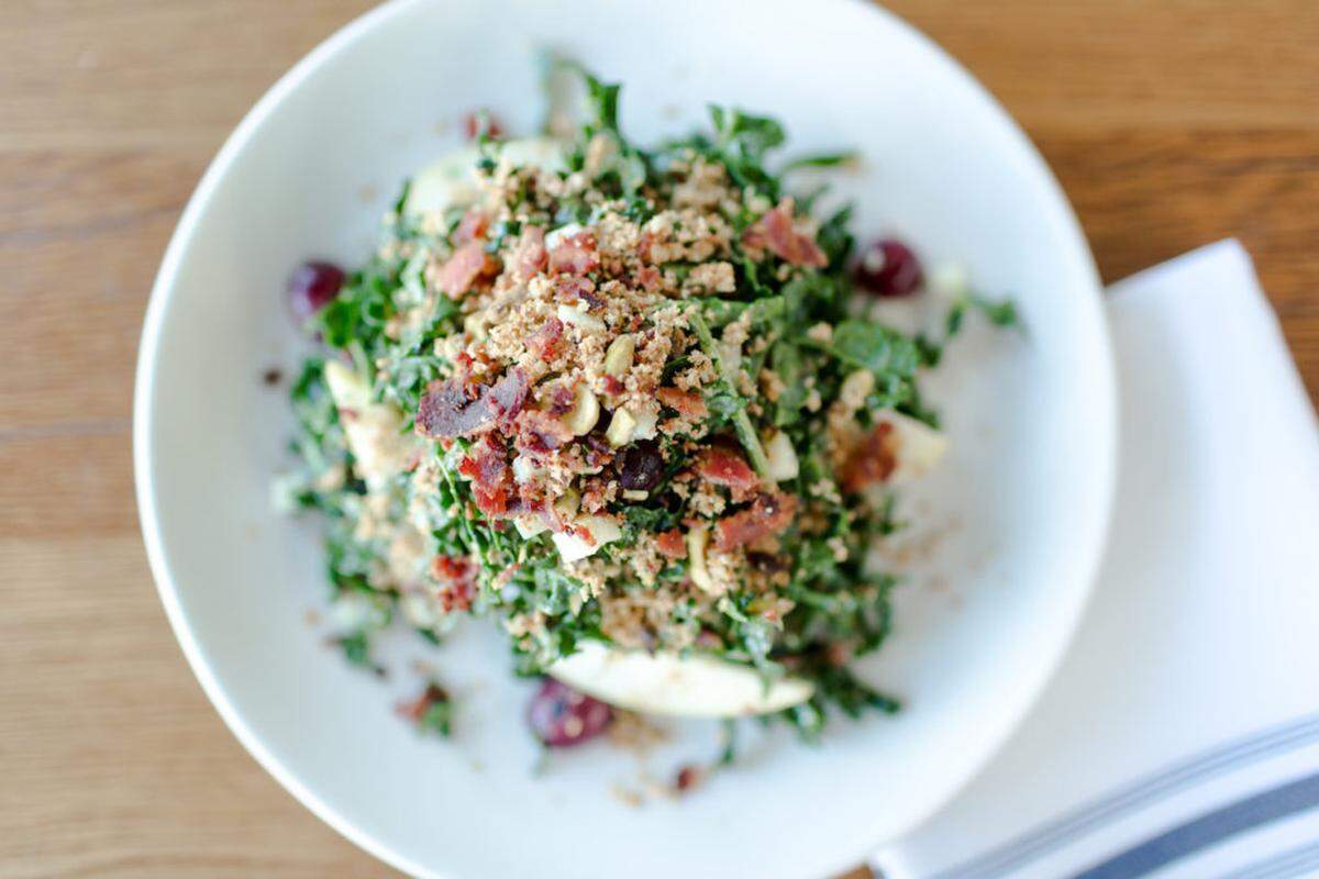 North Italia’s Tuscan Kale Salad is topped with crispy pancetta, charred grapes, apple, pistachio, breadcrumbs and parmesan vinaigrette ($11).
