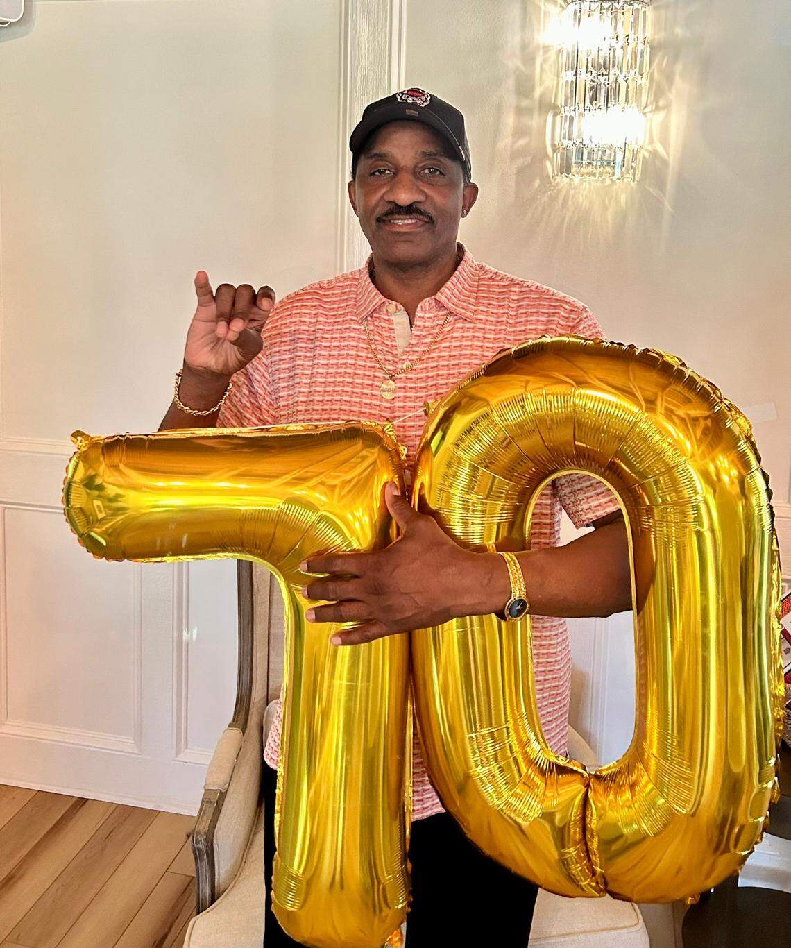 Former N.C. State star basketball player David Thompson turned 70 on July 13, 2024. At his birthday party that day, he held the numbers “70” to signify his age and made the “Wolfie” hand sign to signify his allegiance to the school he led to the NCAA basketball championship in 1974.