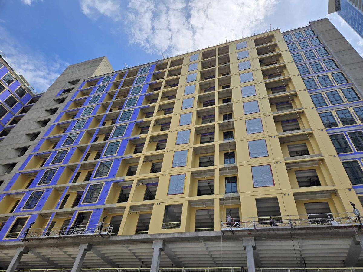 Construction workers are making progress on converting Duke Energy’s former headquarters into a housing and retail development.