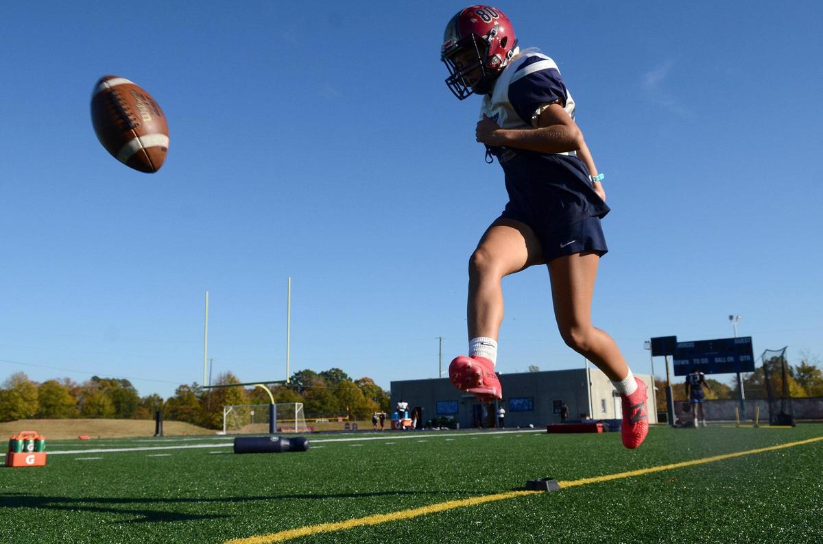 Charlotte Stavis, 17, is a girls soccer center midfielder at Mallard Creek High School who also starts as a kicker on the football team. The senior is playing her second season on the football team.
