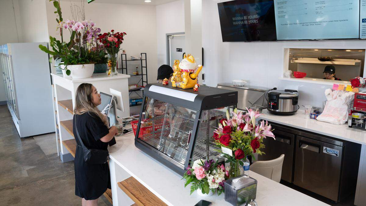 A customer orders at Kim Anh Bánh Mì & Boba.