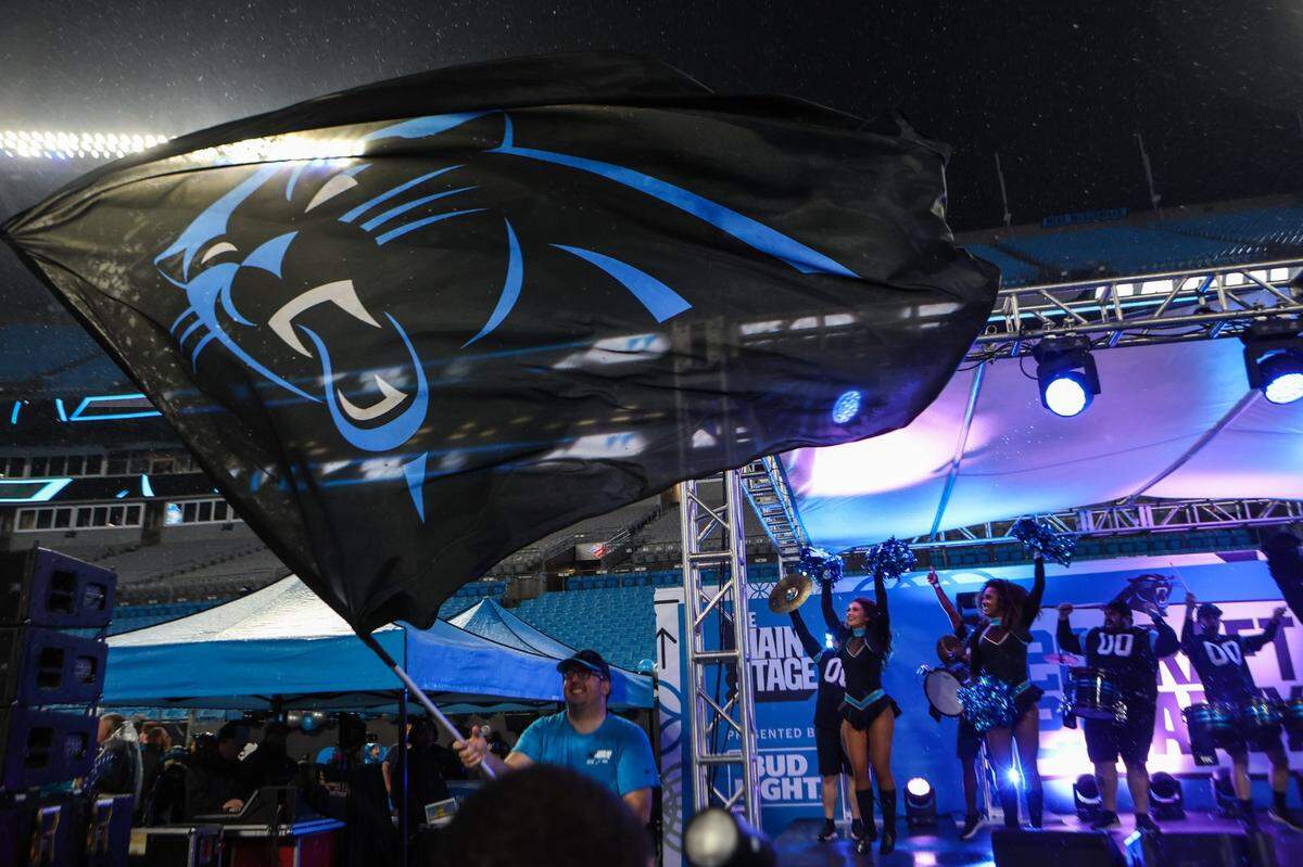 Celebration ensues on the main stage as the Panthers pick quarterback Bryce Young as the number one pick during in the NFL Draft during a fan watch party at Bank of America Stadium on Thursday, April 27, 2023.