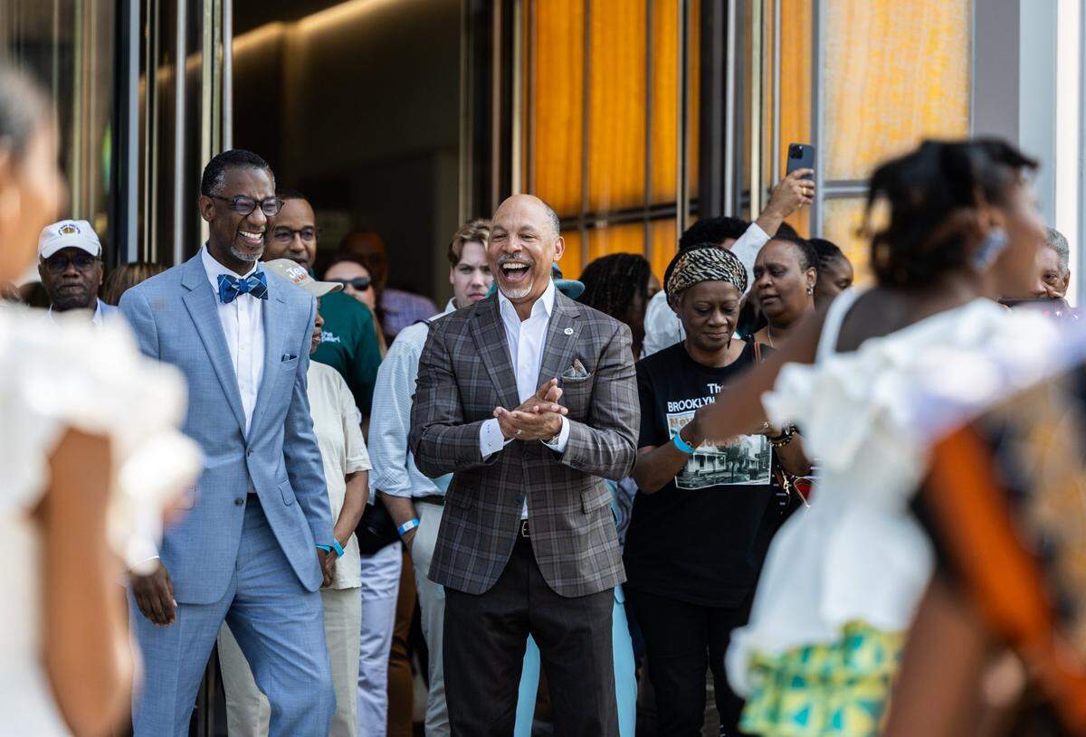 Gene Woods, Chief Executive Officer of Advocate Health, cheers on a performance during the grand opening of The Pearl in early June.