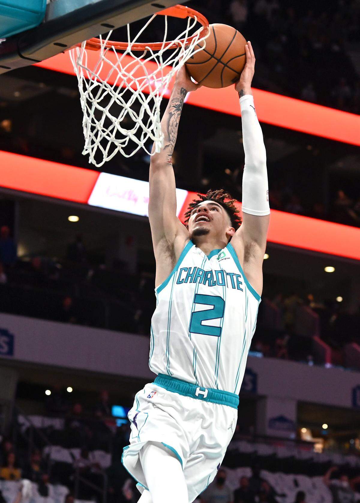 Charlotte Hornets guard LaMelo Ball drives to the basket for a two-handed dunk against Indiana Wednesday.
