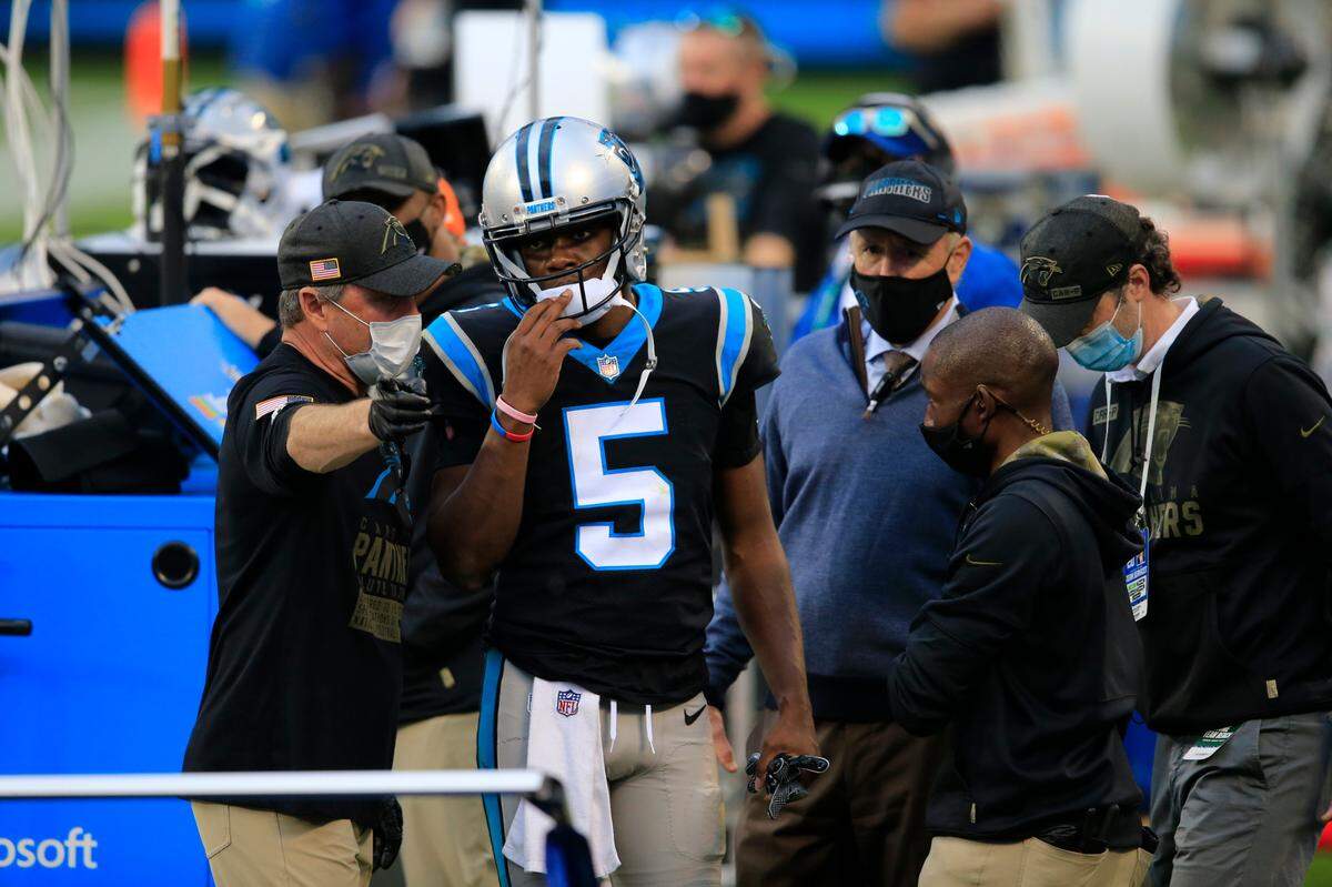 Carolina Panthers quarterback Teddy Bridgewater (5) walks off the field after being injured on a sack against the Tampa Bay Buccaneers in the fourth quarter Sunday.