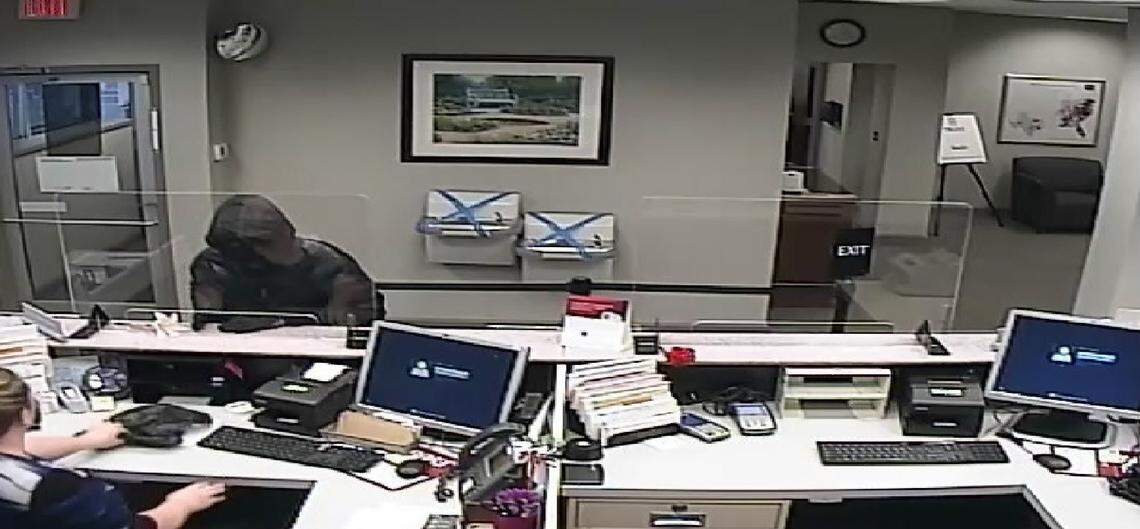 Video surveillance inside the Newton BB&T bank branch shows Spenc’r Rickerson demanding money from a teller in March 2021.