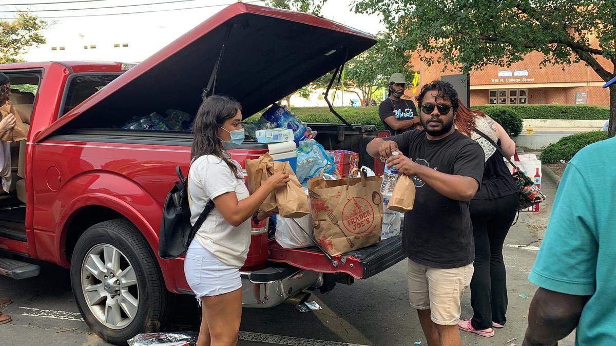 People with Million Youth March of Charlotte and Salisbury organized a drive for food, water and toiletries to distribute to homeless people on June 10, 2020.
